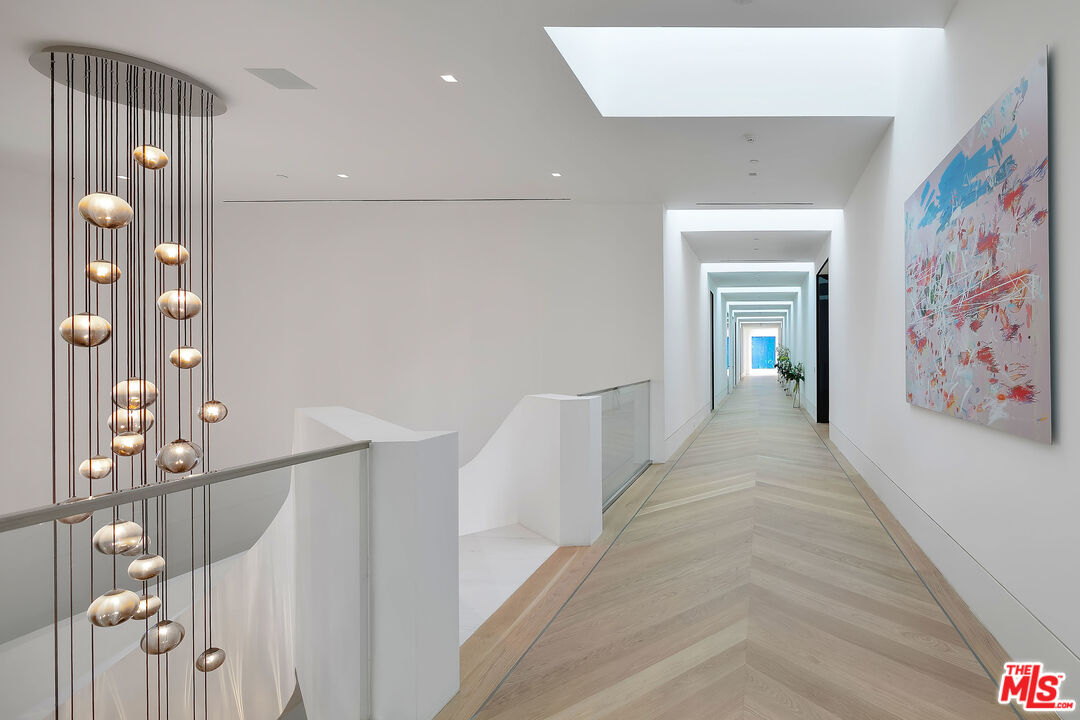 10701 Bellagio Road Los Angeles, CA 90077 - Photo 20 of 36 a view of hallway with furniture and wooden floor