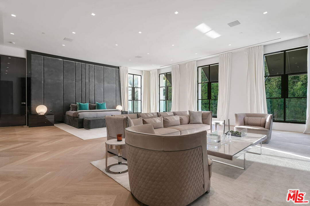 10701 Bellagio Road Los Angeles, CA 90077 - Photo 21 of 36 a living room with furniture and wooden floor