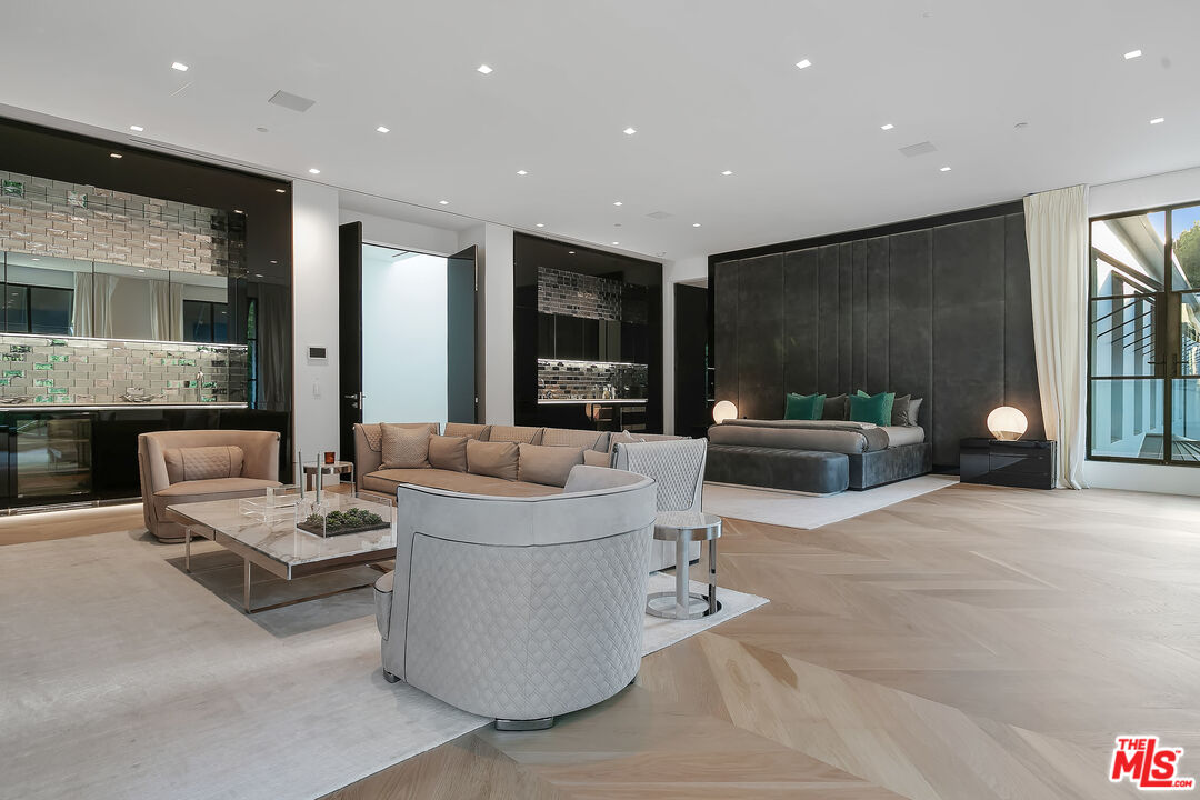 10701 Bellagio Road Los Angeles, CA 90077 - Photo 22 of 36 a living room with furniture and a potted plant