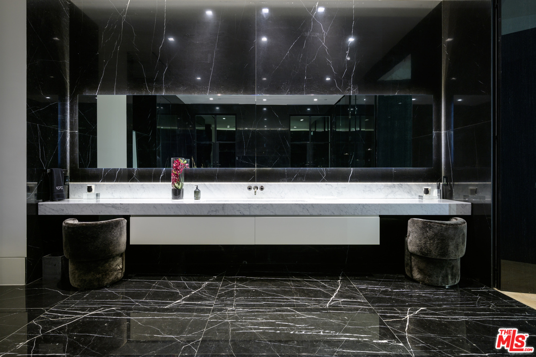 10701 Bellagio Road Los Angeles, CA 90077 - Photo 25 of 36 a bathroom with a sink and a mirror