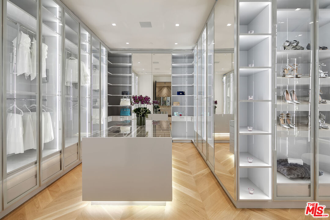 10701 Bellagio Road Los Angeles, CA 90077 - Photo 26 of 36 a living room with furniture and a glass door