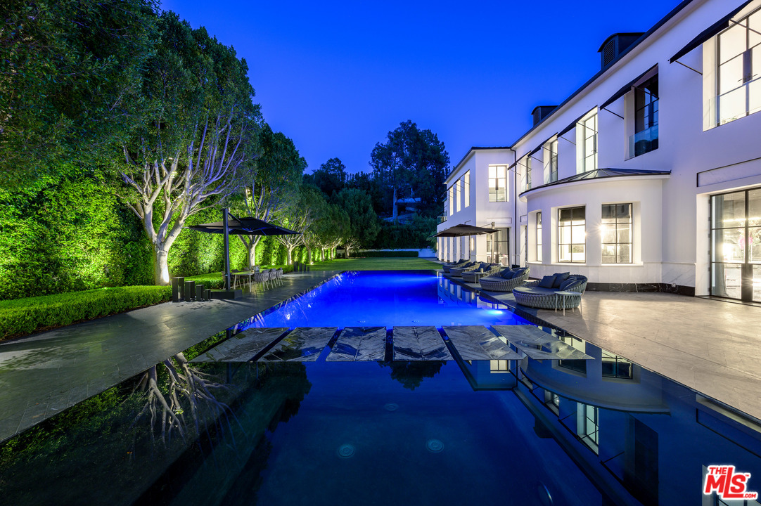 10701 Bellagio Road Los Angeles, CA 90077 - Photo 4 of 36 a view of swimming pool with outdoor seating