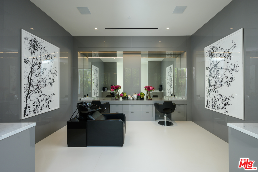 10701 Bellagio Road Los Angeles, CA 90077 - Photo 35 of 36 a living room with furniture large window and flowers