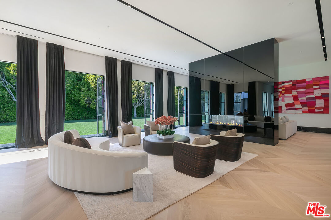10701 Bellagio Road Los Angeles, CA 90077 - Photo 7 of 36 a living room with furniture and a large window