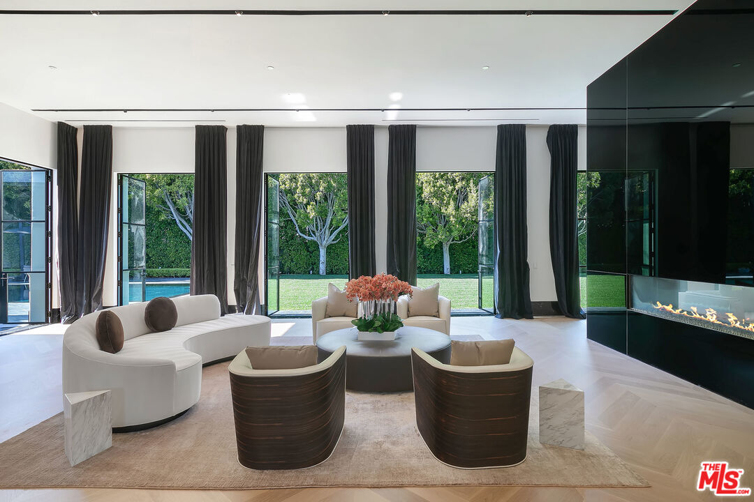 10701 Bellagio Road Los Angeles, CA 90077 - Photo 8 of 36 a living room with furniture and a large window