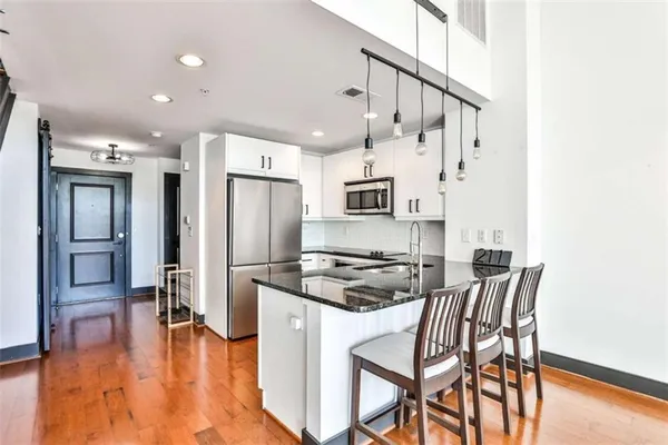 a kitchen with a sink and cabinets