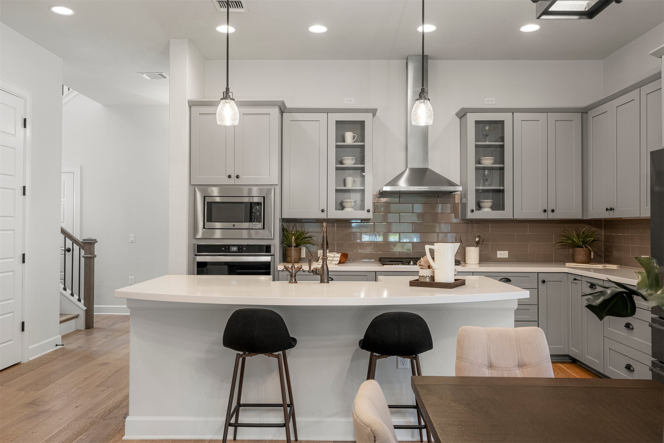 4313 Vaughan Street Austin, TX 78723 - Photo 8 of 39 Wide-plank white oak floors extend into the kitchen area, which features high-end stainless steel cooking appliances and abundant cabinetry