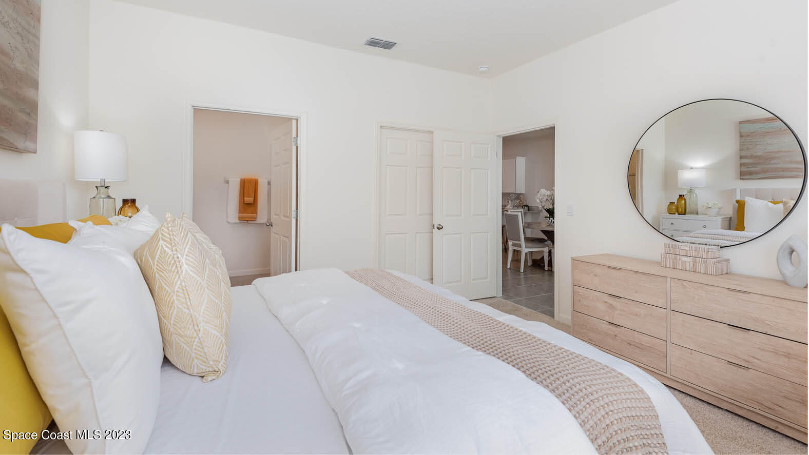 3356 Morrow Place Mims, FL 32754 - Photo 13 of 43 a bedroom with a bed and a mirror