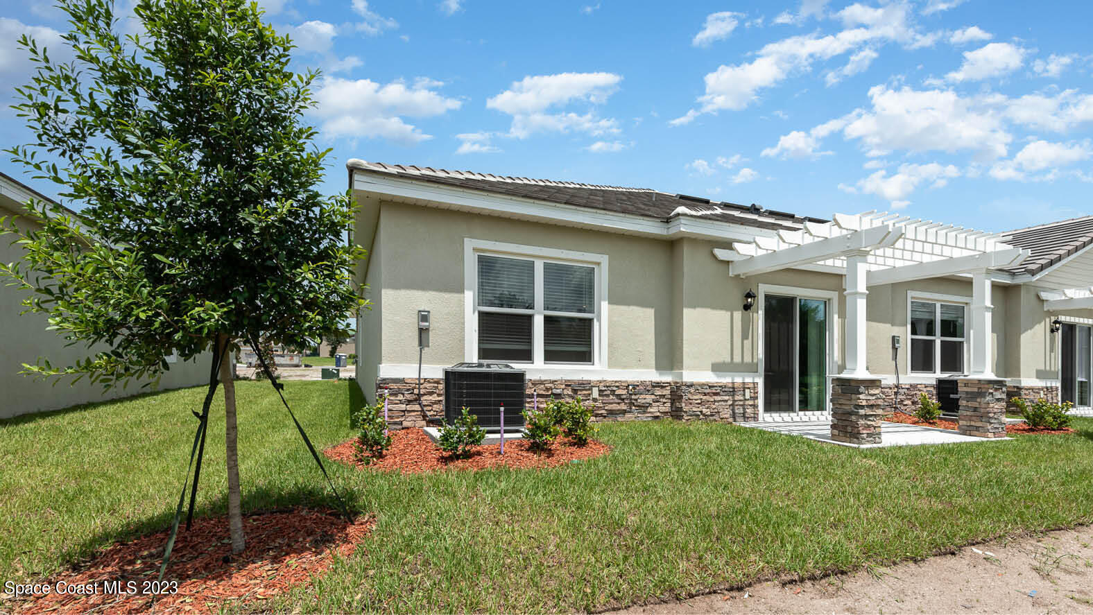 3356 Morrow Place Mims, FL 32754 - Photo 15 of 43 a front view of house with yard and outdoor seating