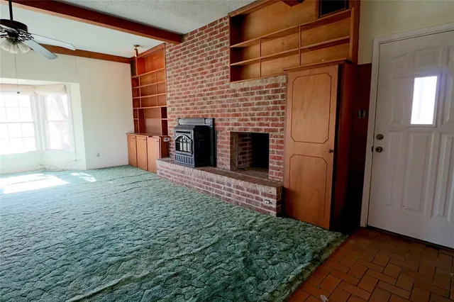 a view of an empty room and window