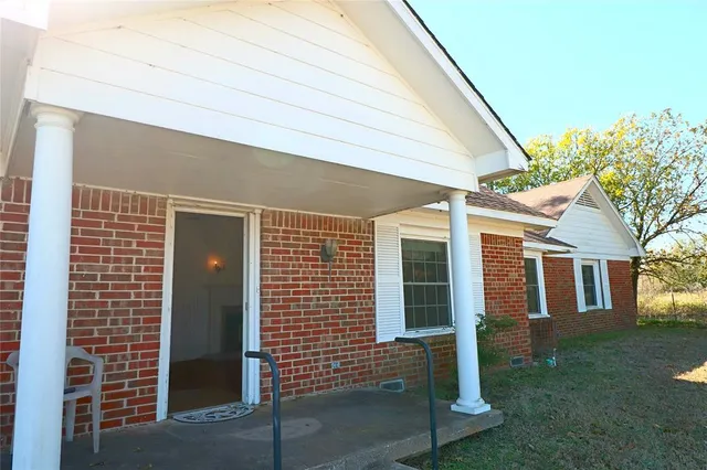 a view of an empty room with a fireplace