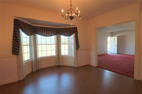 a view of a livingroom with wooden floor