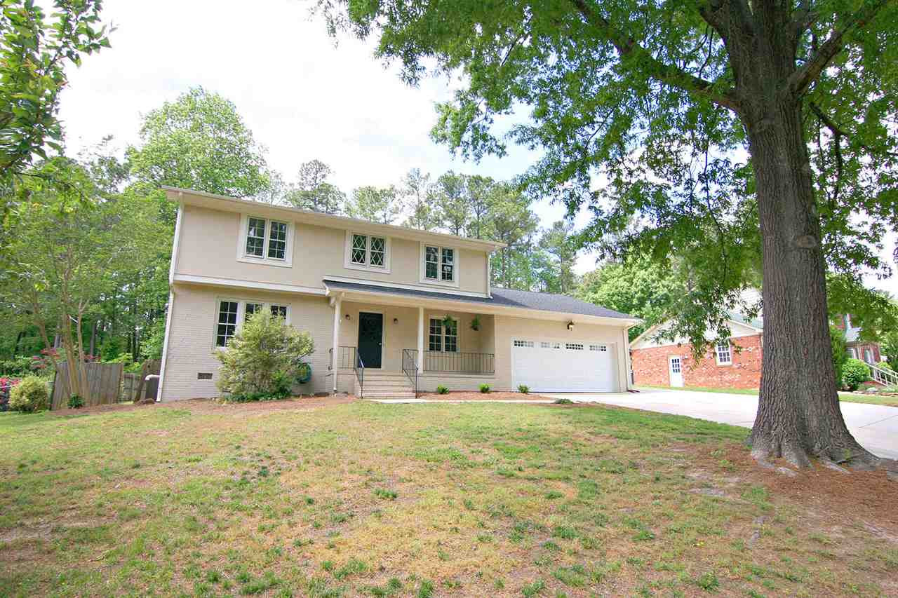 7801 Audubon Drive Raleigh, NC 27615 - Photo 2 of 25 Mature Trees and Winding Roads bring you to this Classic North Ridge Home with Rocking Chair Front Porch + 2 Car Garage and 1/3 Acre Lot. Prime Location -- Best Restaurants, Shopping, Health Clubs, YMCA, Major Roads at your Doorstep. Facade/Exterior Front