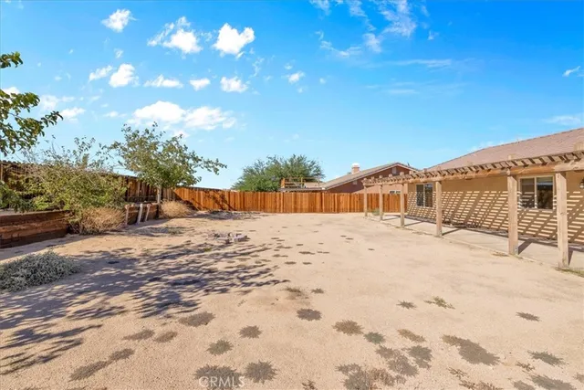 a view of a backyard of the house
