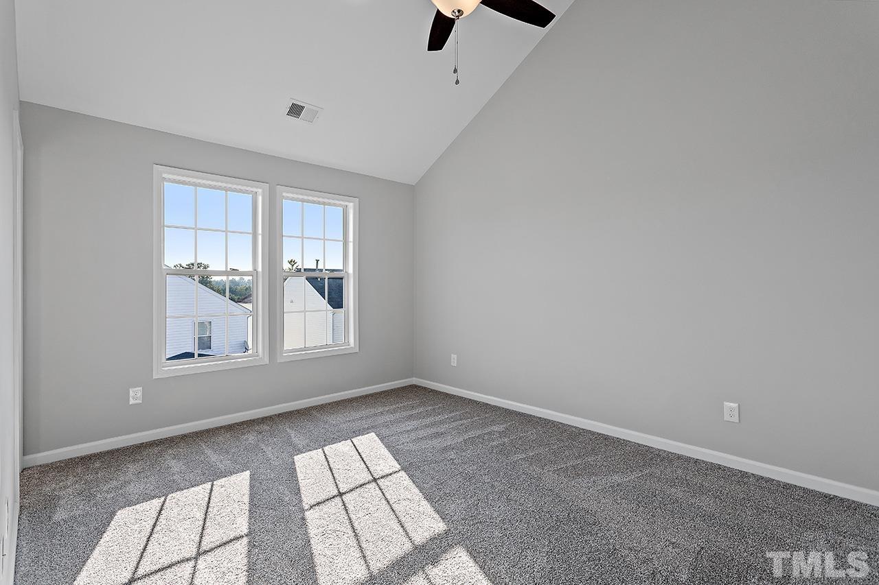 4840 Windblown Court Raleigh, NC 27616 - Photo 16 of 30 an empty room with windows