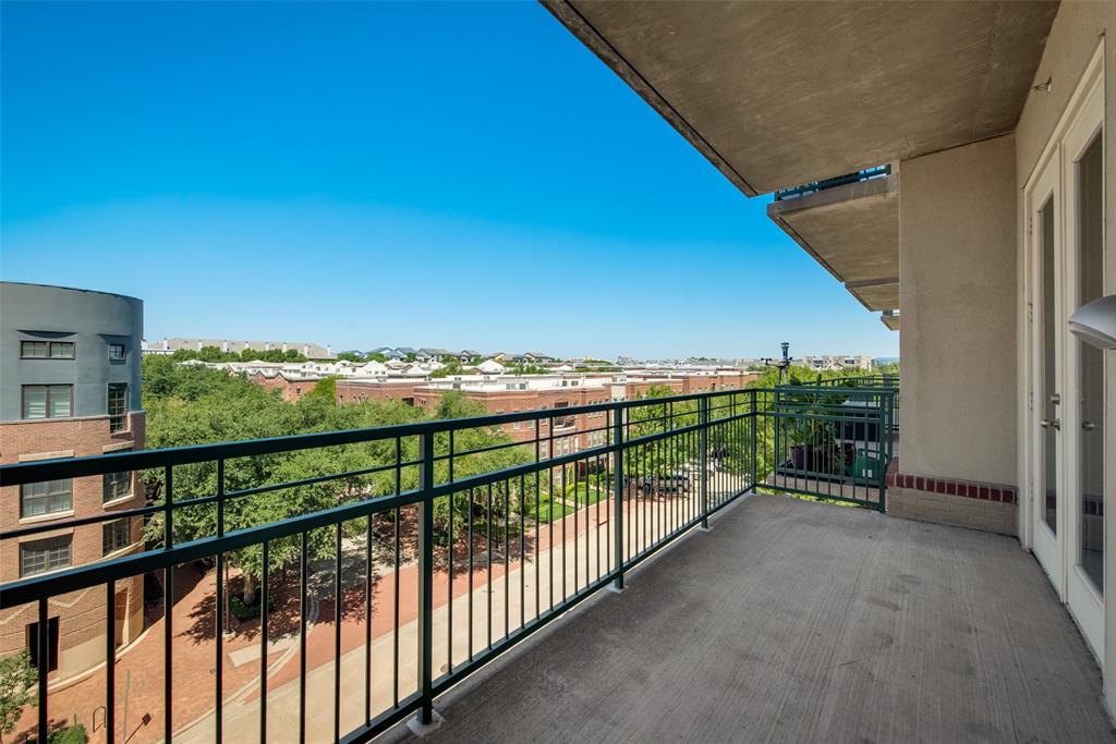 5055 Addison Circle, Unit 407 Addison, TX 75001 - Photo 15 of 22 Living Area's Wide Covered Balcony has Treetop View this way and view of Circle's green space the other way; grill can be used here due to sprinklers in Balcony