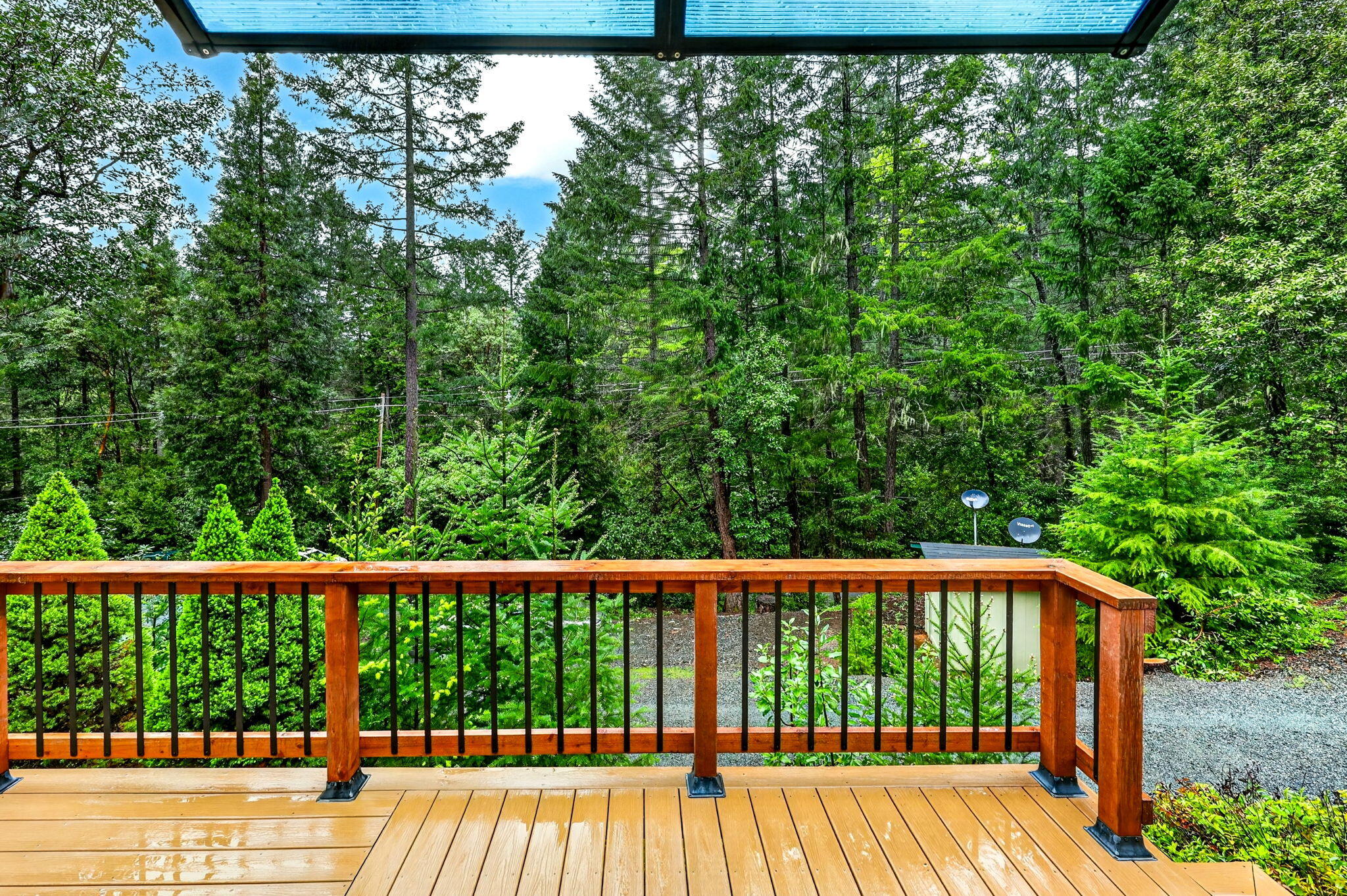 5445 Thompson Creek Road Selma, OR 97538 - Photo 39 of 57 a view of balcony with wooden floor