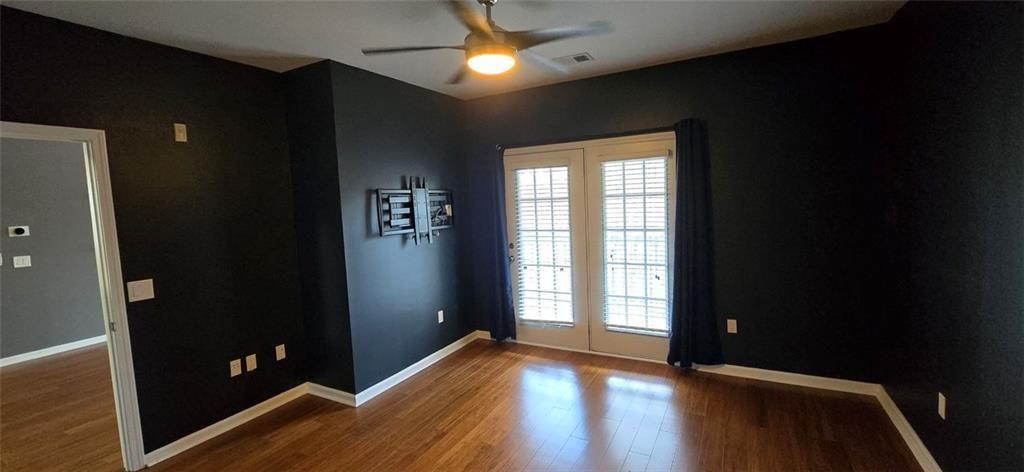 3500 Sweetwater Road, Unit 225 Duluth, GA 30096 - Photo 11 of 34 wooden floor in an empty room with a window