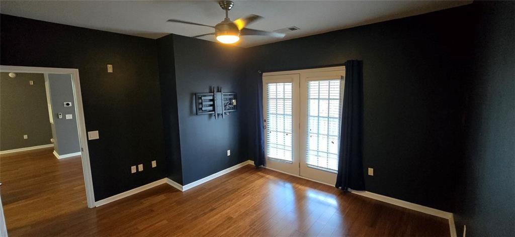 3500 Sweetwater Road, Unit 225 Duluth, GA 30096 - Photo 12 of 34 wooden floor in an empty room with a window
