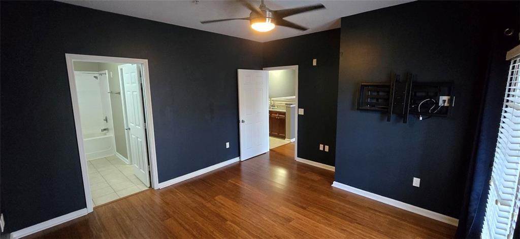 3500 Sweetwater Road, Unit 225 Duluth, GA 30096 - Photo 13 of 34 wooden floor in an empty room with a window