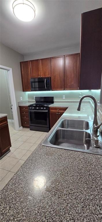 3500 Sweetwater Road, Unit 225 Duluth, GA 30096 - Photo 16 of 34 a kitchen with a sink and a stove top oven