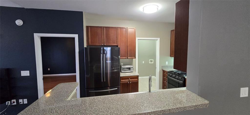 3500 Sweetwater Road, Unit 225 Duluth, GA 30096 - Photo 19 of 34 a kitchen with a refrigerator and a sink