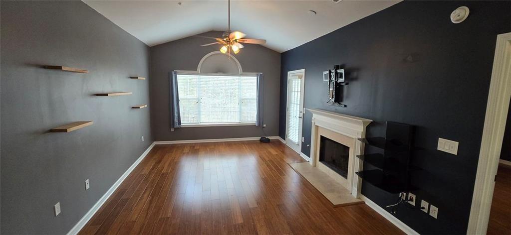 3500 Sweetwater Road, Unit 225 Duluth, GA 30096 - Photo 22 of 34 wooden floor in an empty room with a fireplace