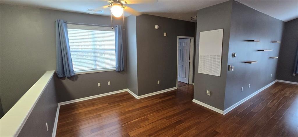 3500 Sweetwater Road, Unit 225 Duluth, GA 30096 - Photo 24 of 34 an empty room with wooden floor and windows