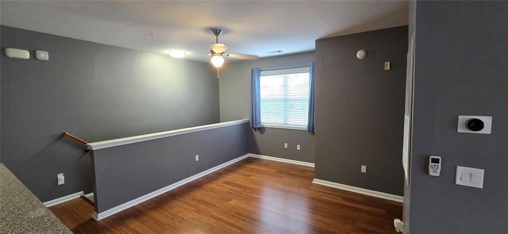 3500 Sweetwater Road, Unit 225 Duluth, GA 30096 - Photo 25 of 34 wooden floor and window in an empty room