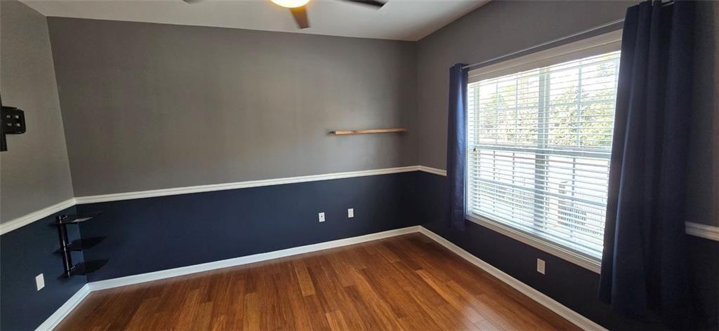 3500 Sweetwater Road, Unit 225 Duluth, GA 30096 - Photo 30 of 34 a view of empty room with wooden floor and fan