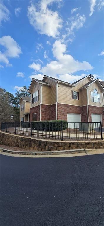 3500 Sweetwater Road, Unit 225 Duluth, GA 30096 - Photo 3 of 34 a front view of a house with a lake view