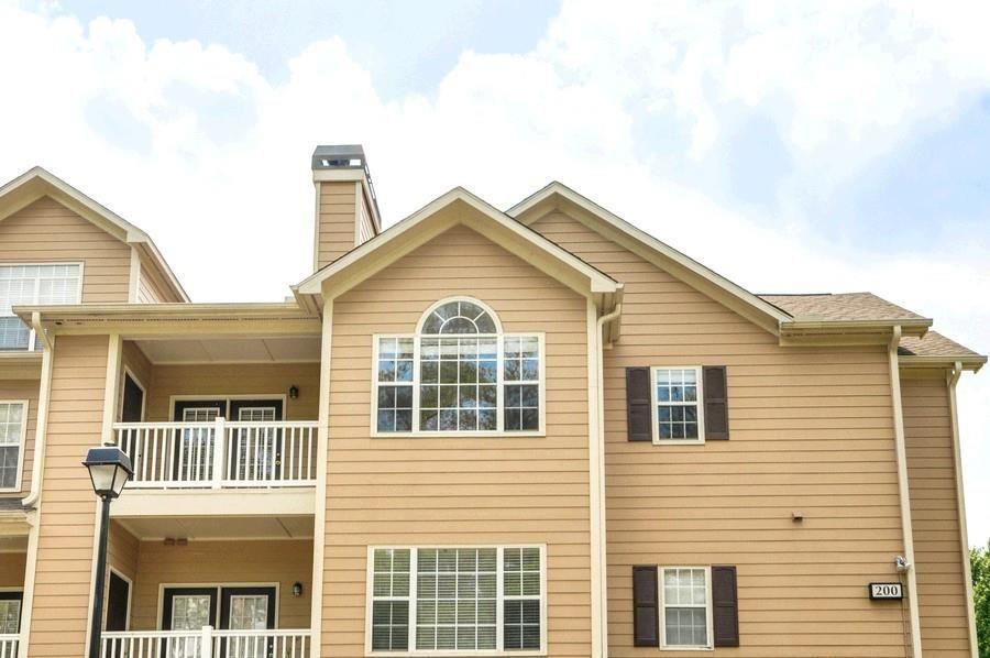 3500 Sweetwater Road, Unit 225 Duluth, GA 30096 - Photo 34 of 34 a view of a white house with large windows
