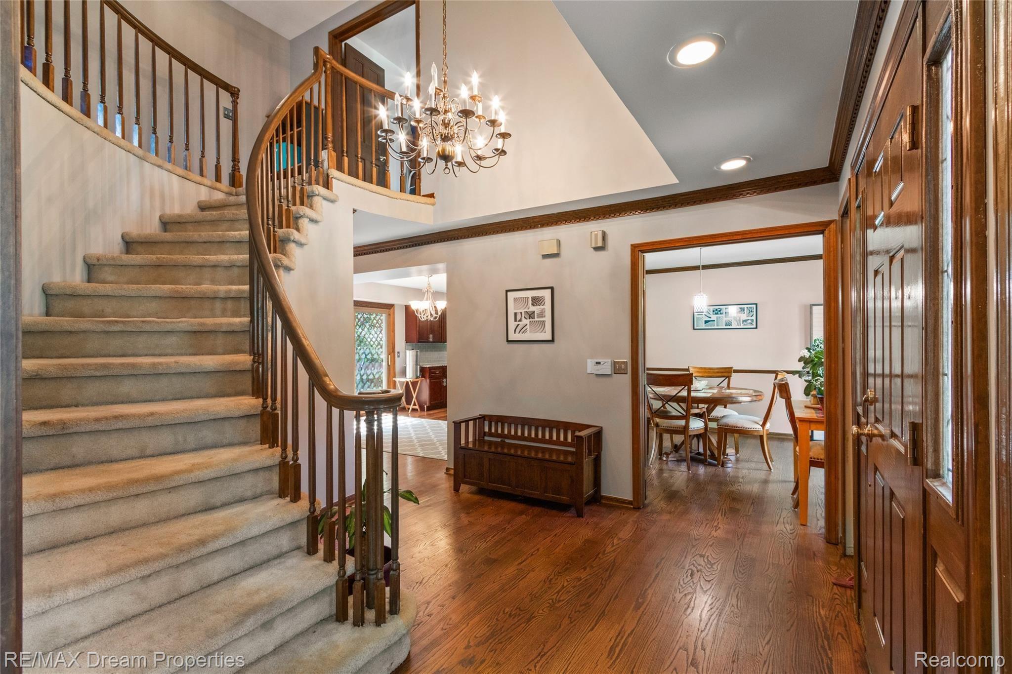 3110 Burlington Drive Rochester, MI 48306 - Photo 8 of 34 FOYER ENTRY TO DRAMATIC 2 STORY WINDING STAIRCASE VIEW INTO FORMAL DINING AREA TO NEWLY REMODELED KITCHEN