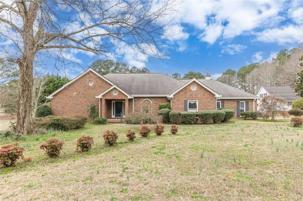 1380 Elliott Road McDonough, GA 30252 - Photo 1 of 33 a front view of a house with a yard