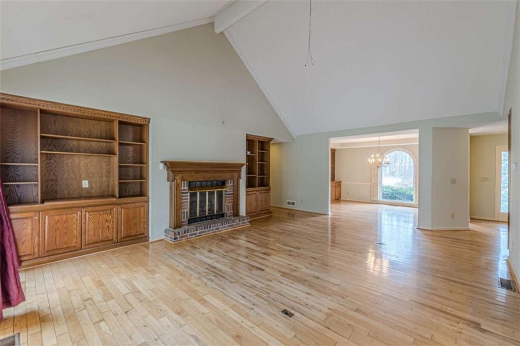 1380 Elliott Road McDonough, GA 30252 - Photo 11 of 33 a view of a livingroom with wooden floor and a fireplace