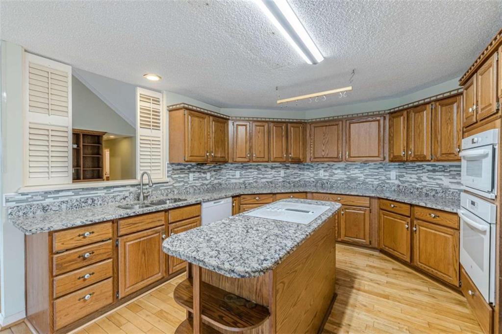 1380 Elliott Road McDonough, GA 30252 - Photo 12 of 33 a kitchen with cabinets appliances and a counter space