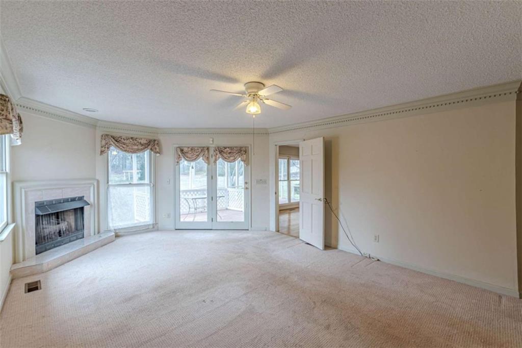1380 Elliott Road McDonough, GA 30252 - Photo 15 of 33 a view of livingroom with furniture fireplace and window
