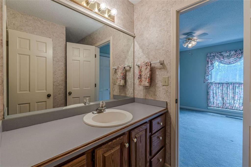 1380 Elliott Road McDonough, GA 30252 - Photo 21 of 33 a bathroom with a sink double vanity and a mirror