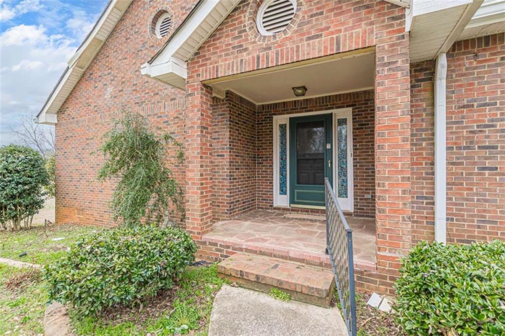 1380 Elliott Road McDonough, GA 30252 - Photo 4 of 33 a front view of a house with a garden