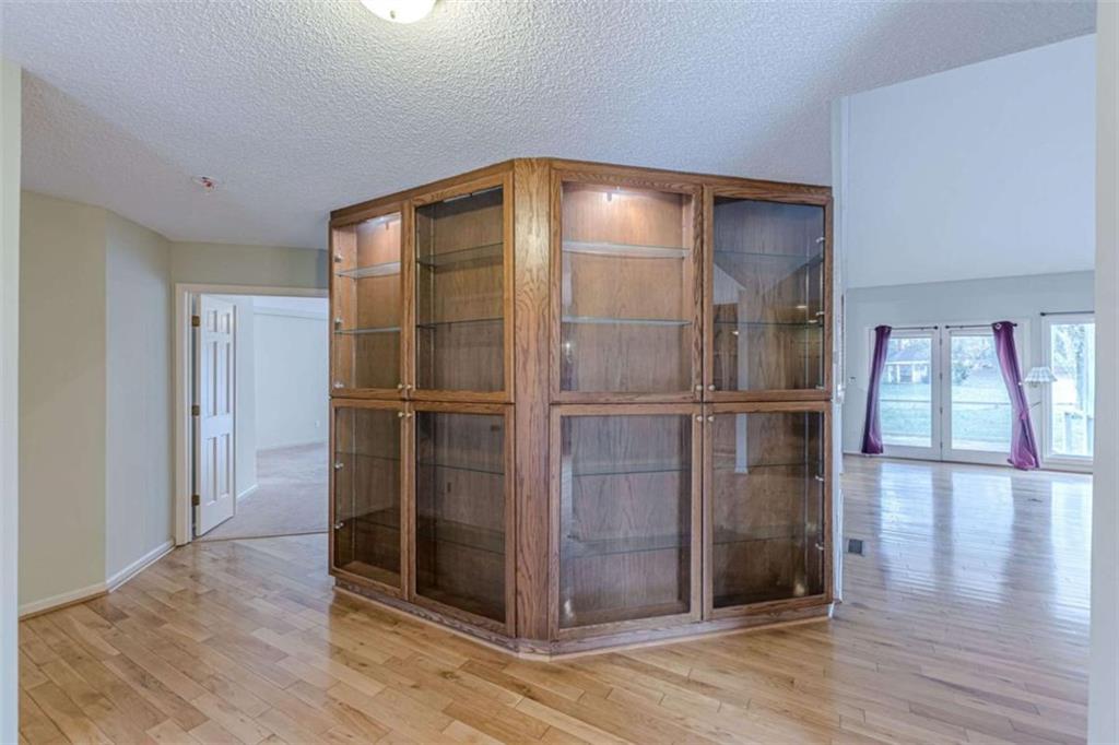 1380 Elliott Road McDonough, GA 30252 - Photo 6 of 33 a empty room with wooden floor and a fireplace