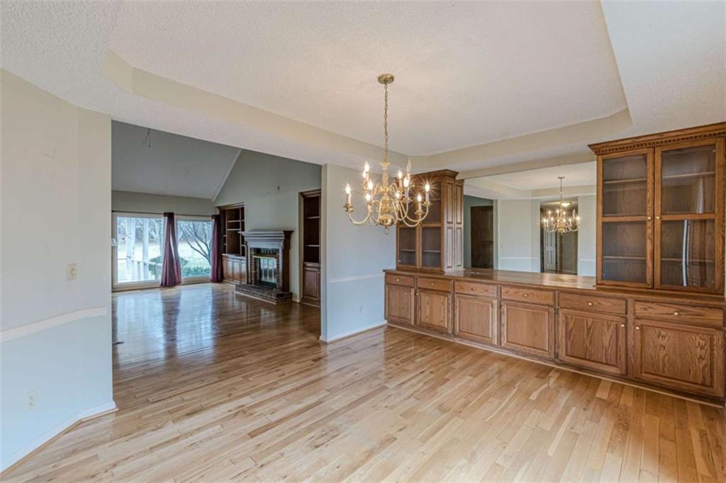 1380 Elliott Road McDonough, GA 30252 - Photo 9 of 33 a large kitchen with sink a refrigerator and wooden floor