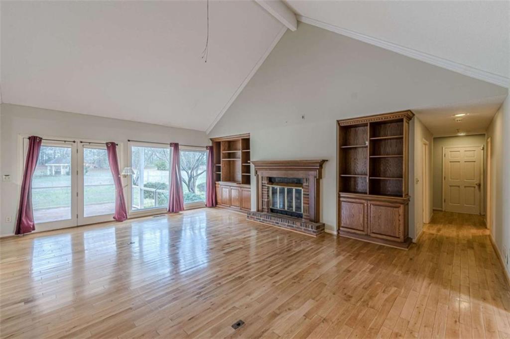 1380 Elliott Road McDonough, GA 30252 - Photo 10 of 33 a view of an empty room with wooden floor and a window
