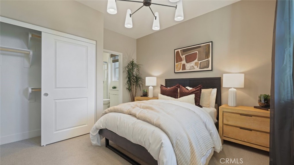 300 Junco Irvine, CA 92618 - Photo 15 of 34 a spacious bedroom with a bed and a painting on the wall