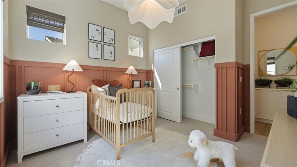 300 Junco Irvine, CA 92618 - Photo 19 of 34 a bedroom with a bed and a chandelier