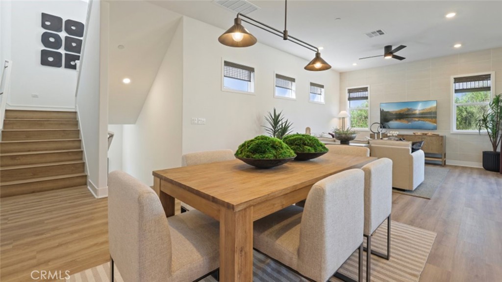 300 Junco Irvine, CA 92618 - Photo 6 of 34 a view of a dining room with furniture and wooden floor