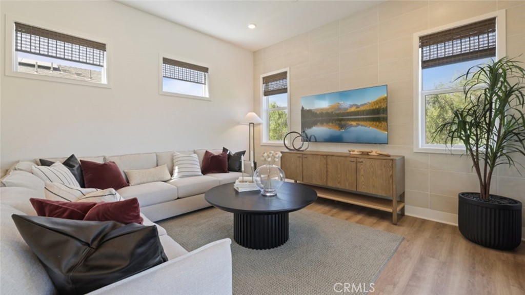 300 Junco Irvine, CA 92618 - Photo 8 of 34 a living room with furniture and a potted plant