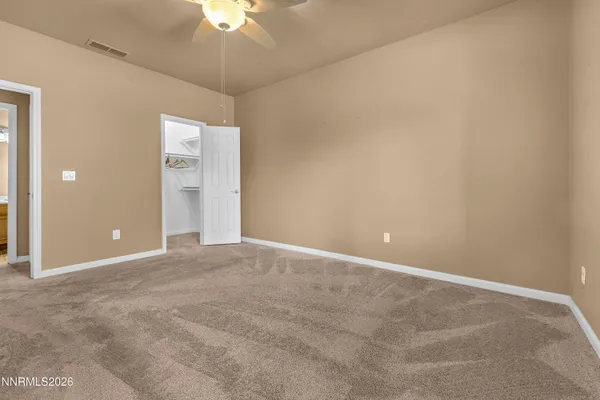 a view of an empty room with a bathroom