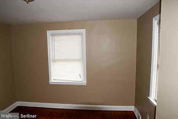 8121 Old Philadelphia Road Baltimore, MD 21237 - Photo 13 of 22 a view of small space with wooden floor and a window
