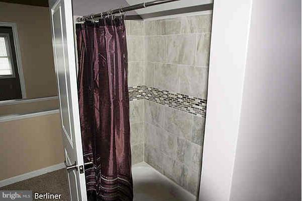 8121 Old Philadelphia Road Baltimore, MD 21237 - Photo 19 of 22 a bathroom with a shower and a sink