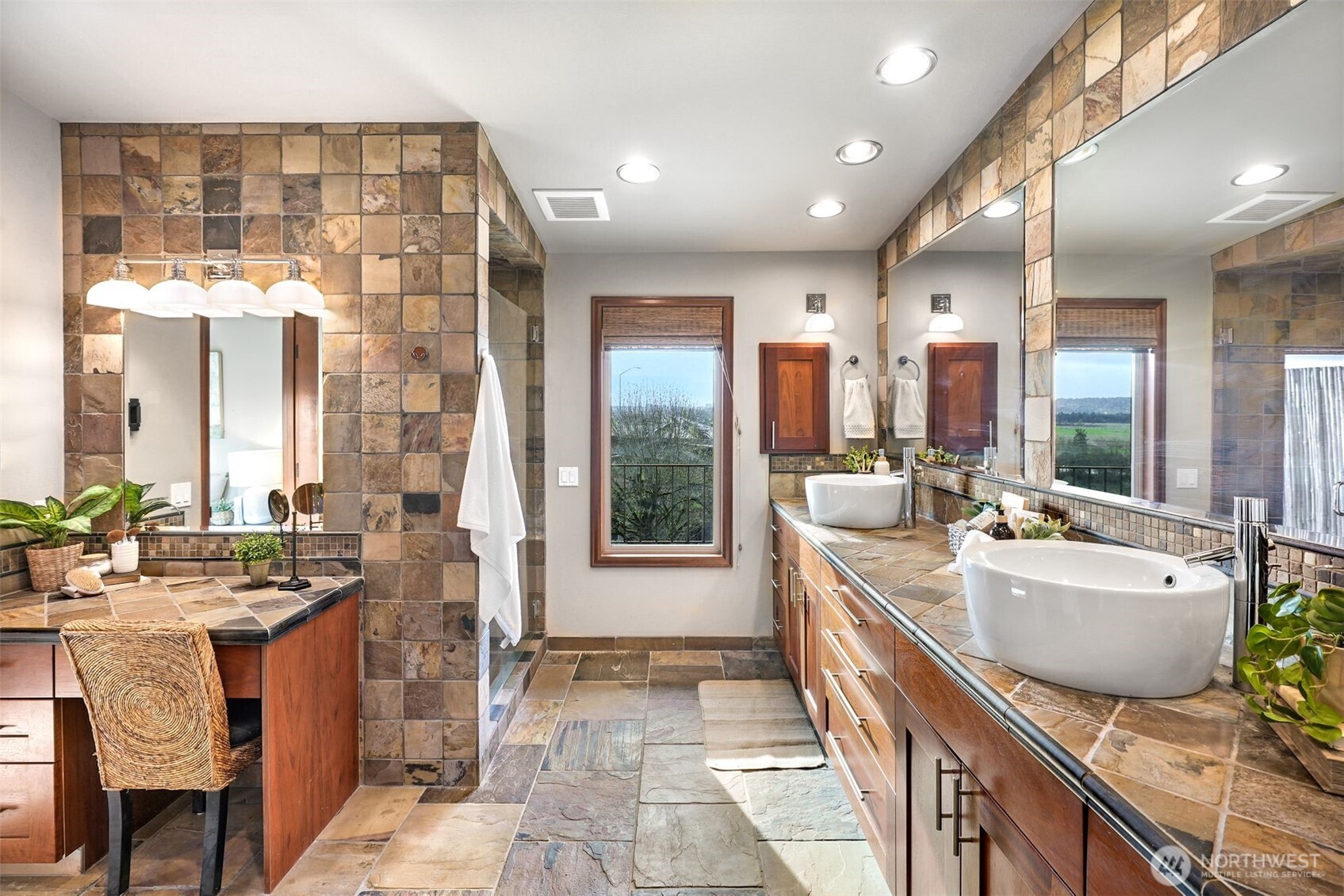 2004 Valley View Drive Lake Stevens, WA 98258 - Photo 15 of 40 a spacious bathroom with a double vanity sink a mirror a bathtub and next to a window